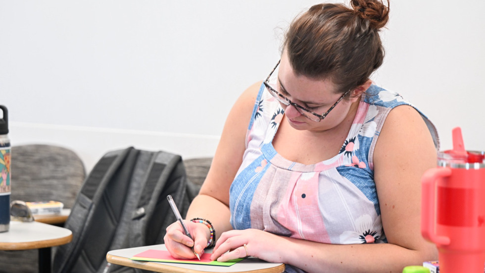 Person writing a letter 