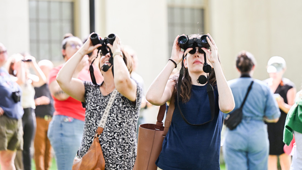 two people birdwatching