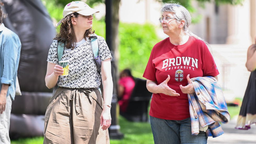 two people walking and talking