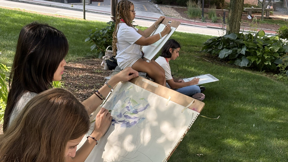 students work on sketches in a visual arts class