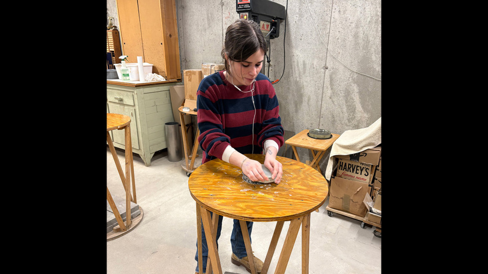 a person working at a small round table