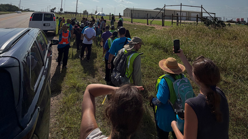 Lachlan Kirby takes part in a solidarity march to Dilley, Texas