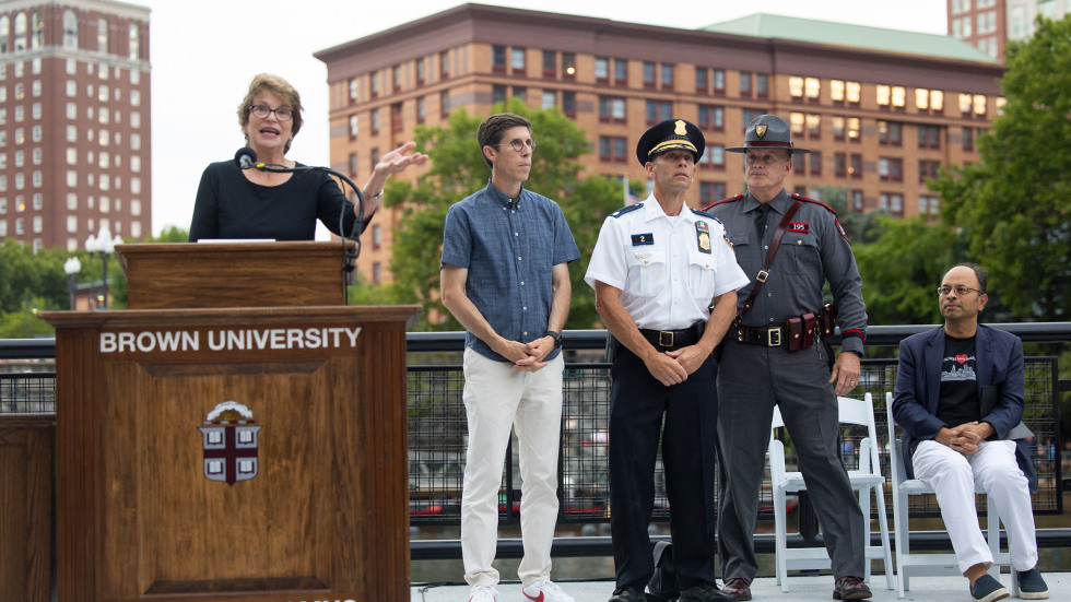 Brown president Christina Paxson acknowledged city leaders at the podium at WaterFire providence 