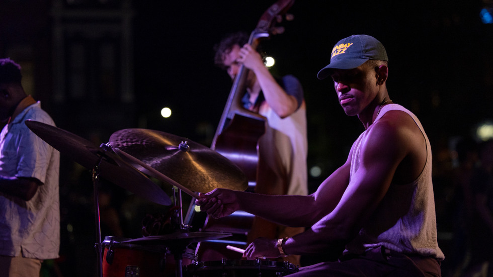 brown ph.d. student marcus grant plays drums as part of the musicians featured at waterfire providence