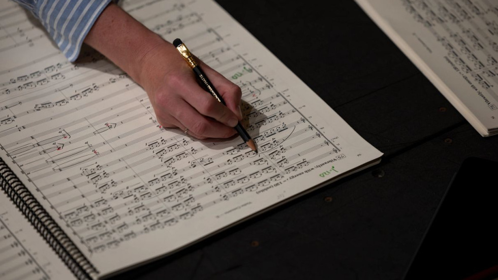 Conductor taking notes 