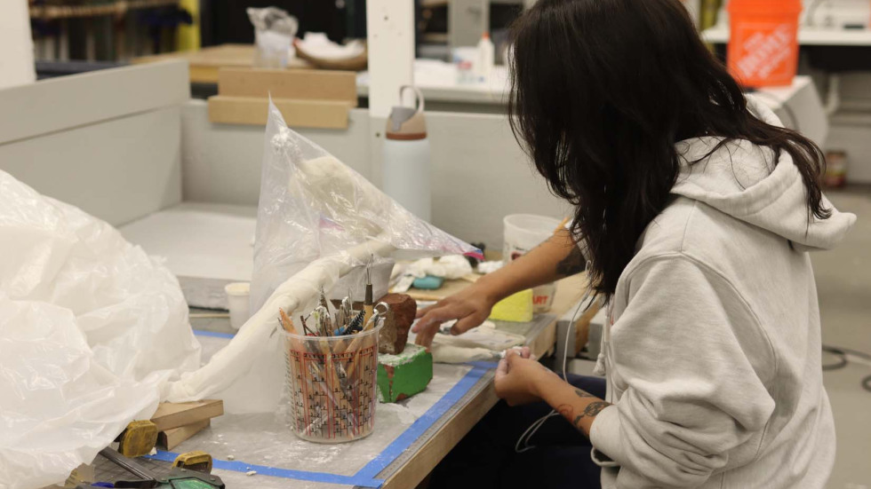 a student works at a studio table