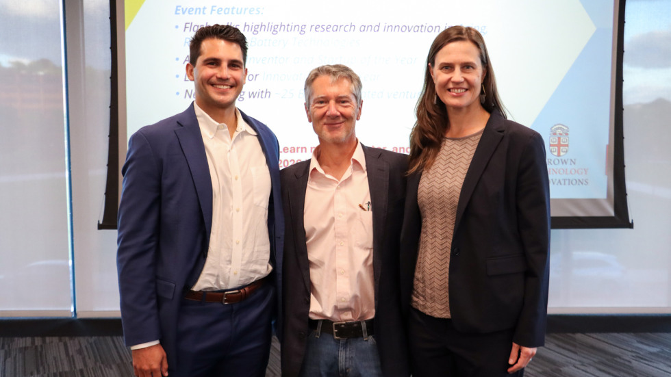 Three founders that presenting during the pitch night stand for a photo.