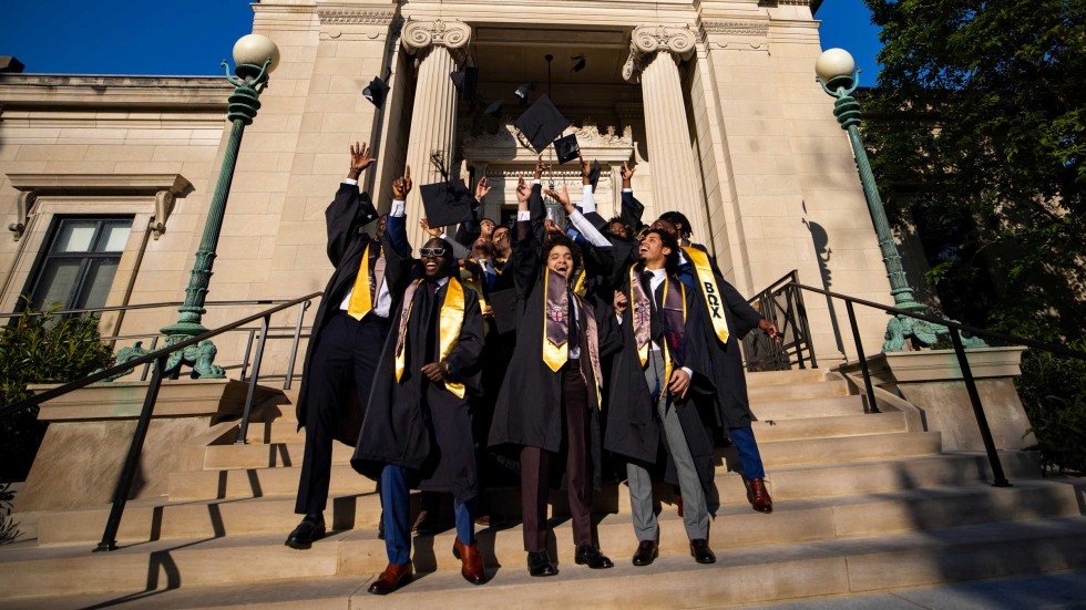 Students celebrating graduating