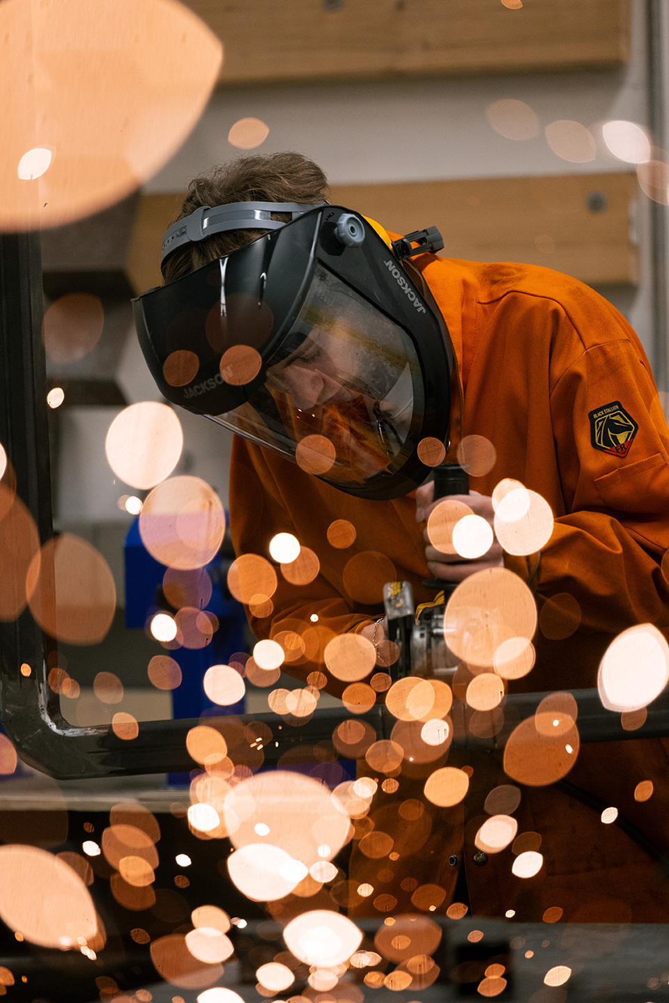 student doing metal work