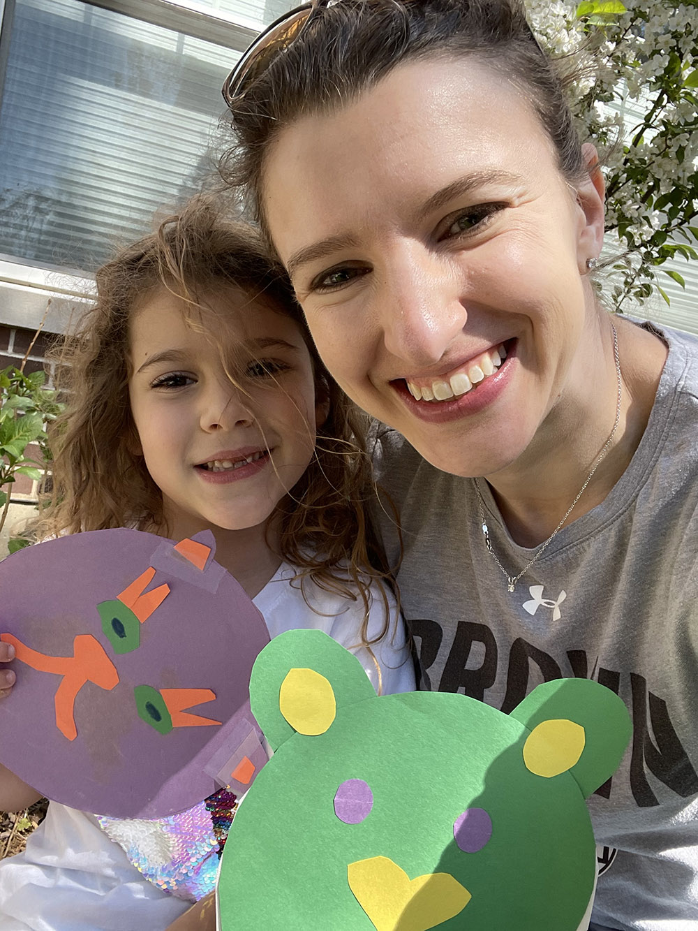 Sarah Hurwit Gomel, Class of 2006, and her daughter Olivia share crafts they made during Bruno Family Fun.