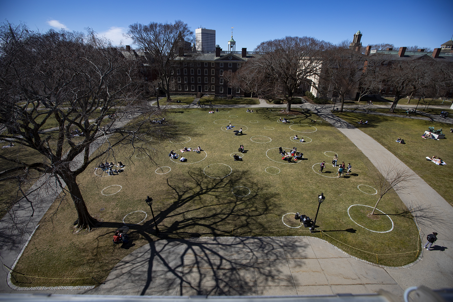 Students join podmates in socially distanced circles on the Campus Green