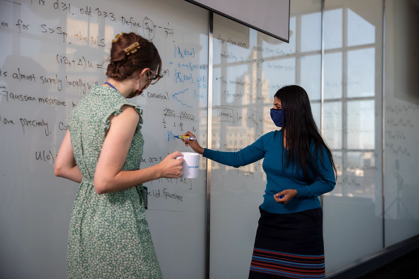 Photo of Kavita Ramanan talking with a student