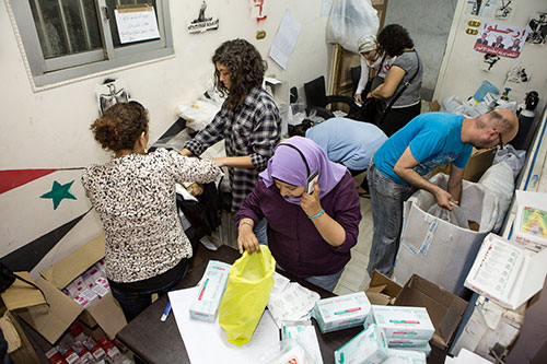 Volunteers sorting through medical supplies