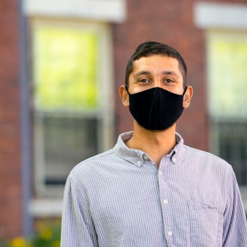 Graduate student wearing a mask