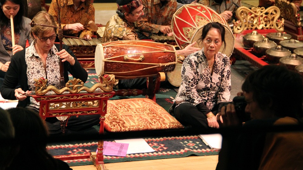 Two women playing Indonesian instruments