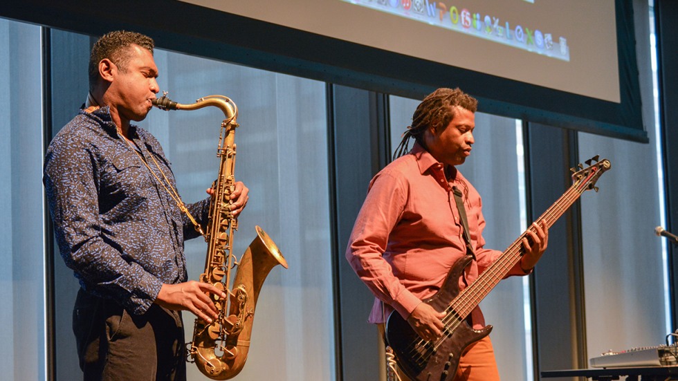 Two musicians playing sax and bass