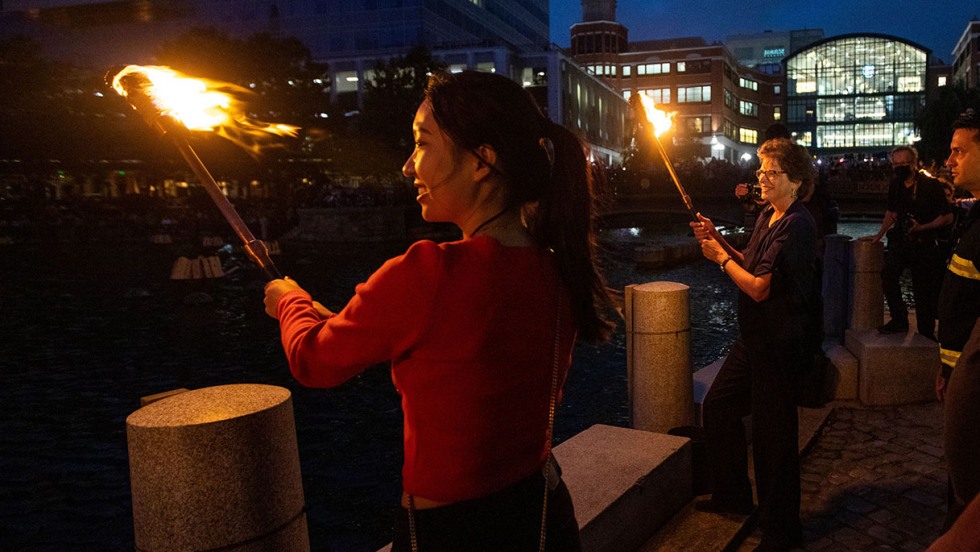 Brown torch-bearers during WaterFire