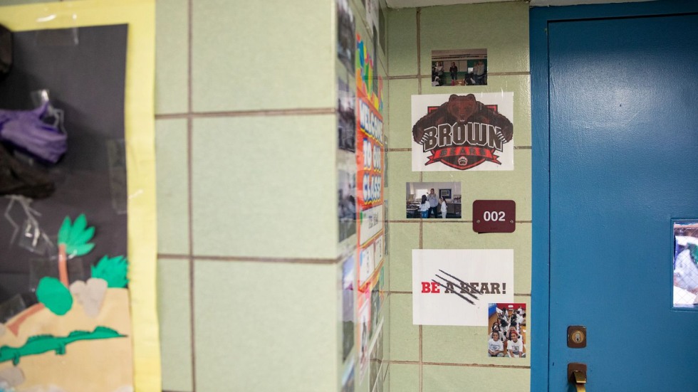 classroom door decorated with Brown University paraphernalia