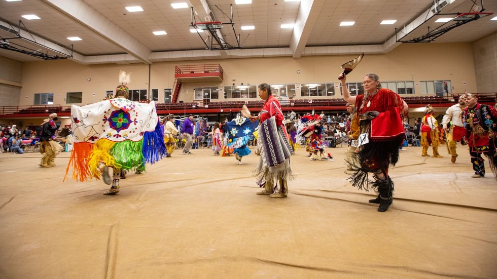 people dancing in Native American regalia
