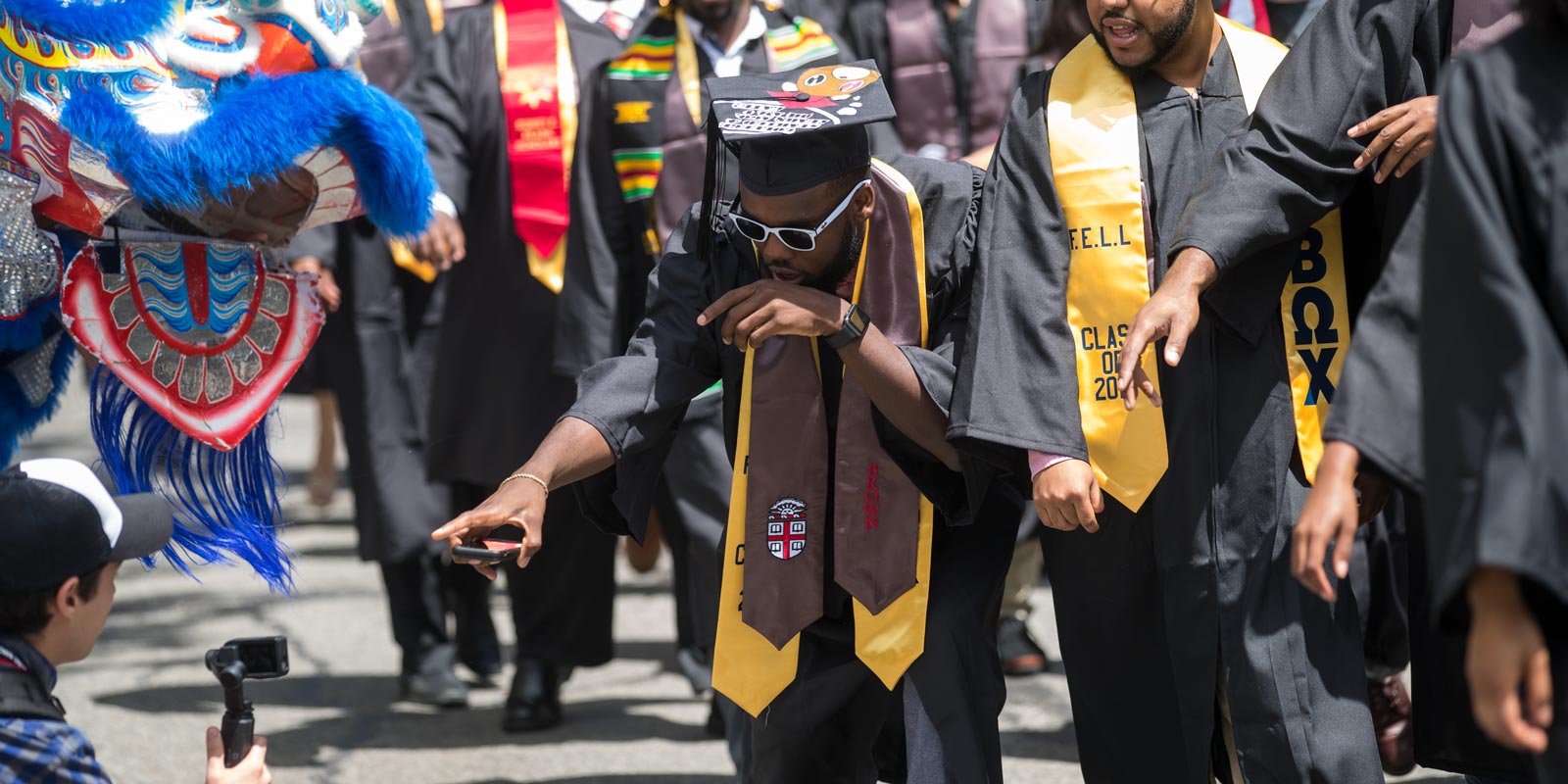 Jordan Ferguson gestured for the camera as he and his fellow Class of 2017 graduates processed to the First Baptist Church for the Baccalaureate