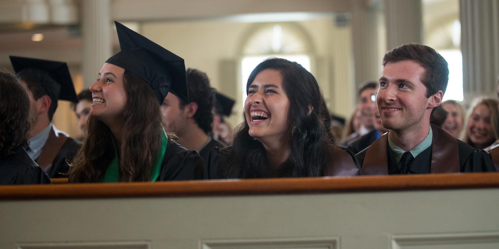 Jessica Kenny, Monica Trevino and Ben Shanahan shared a laugh during Diggs' speech, which included personal stories, performance and a plea for graduates to work every day to help create fellowship in America.