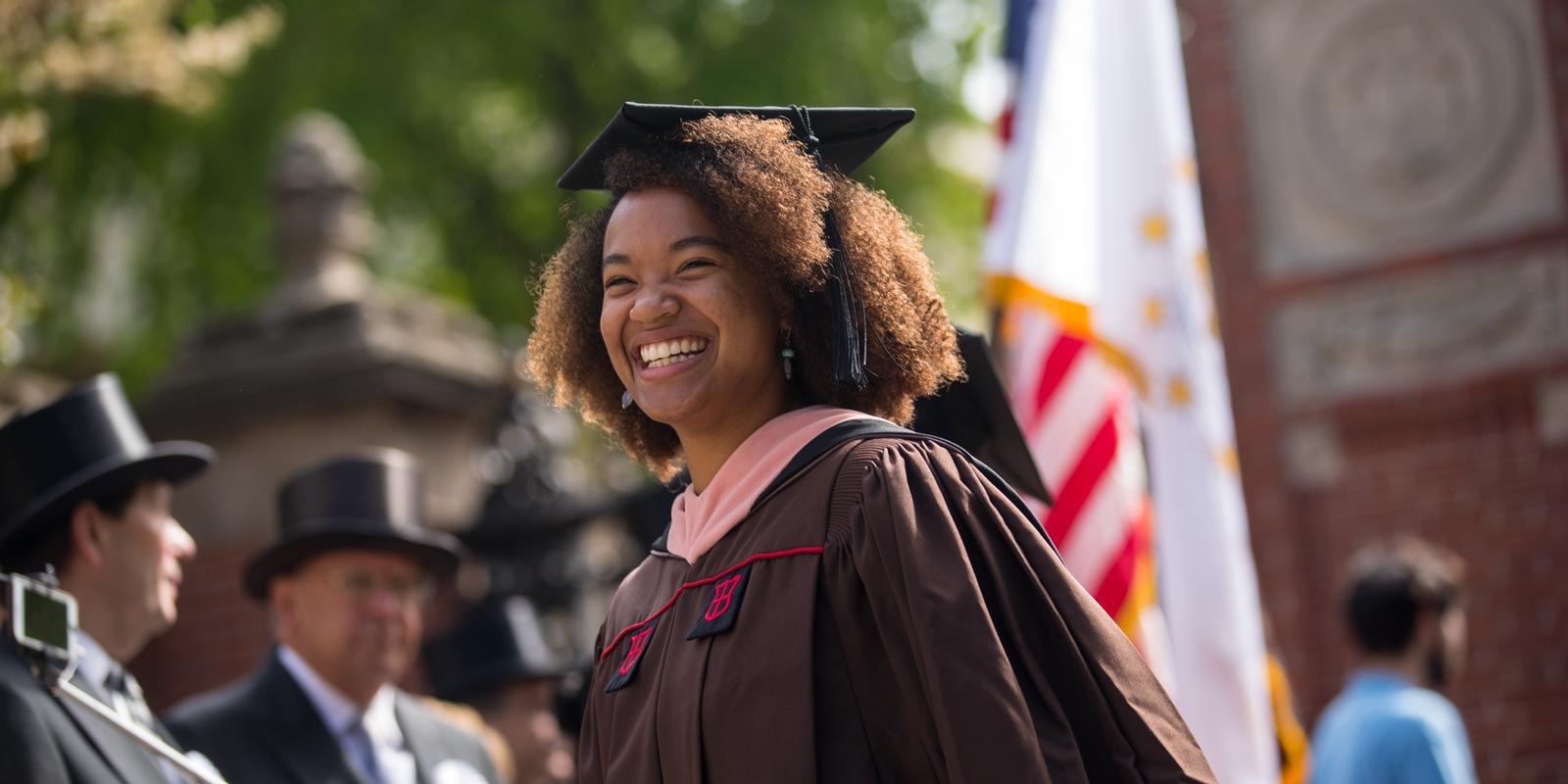 Morayo Akande, who earned a master of public health degree, smiled after passing through the Van Wickle Gates.