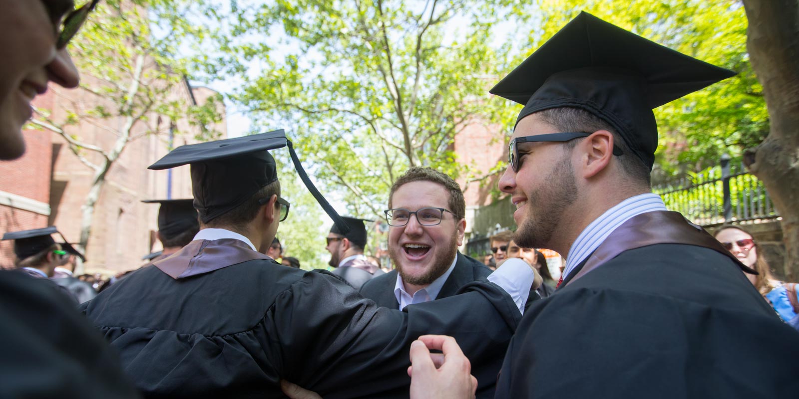 Dillon O'Carroll, Class of 2015, cheered on his former Brown football teammates as they march down College Hill.