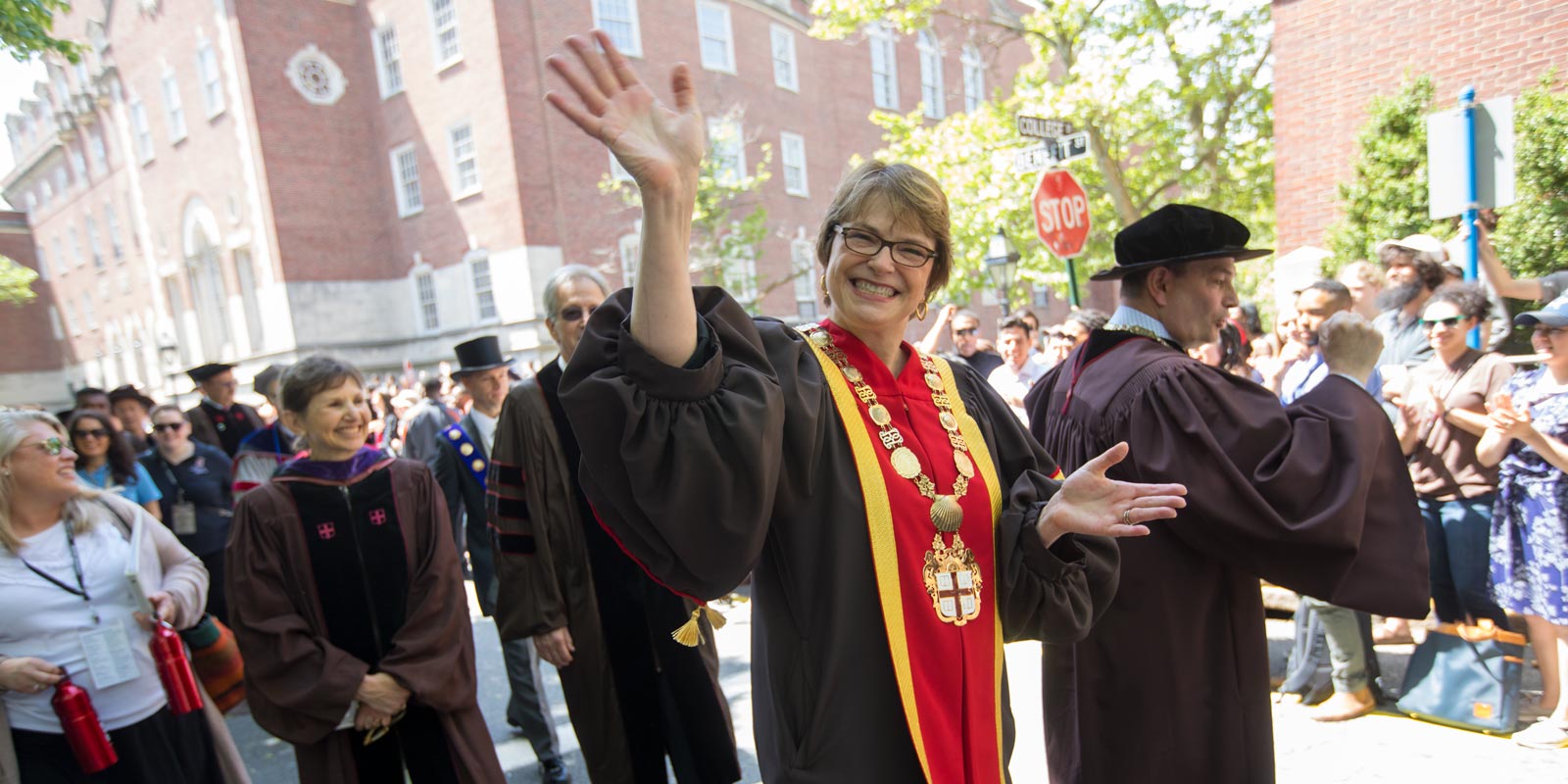 President Paxson waved to alumni as she marched down Benefit Street.