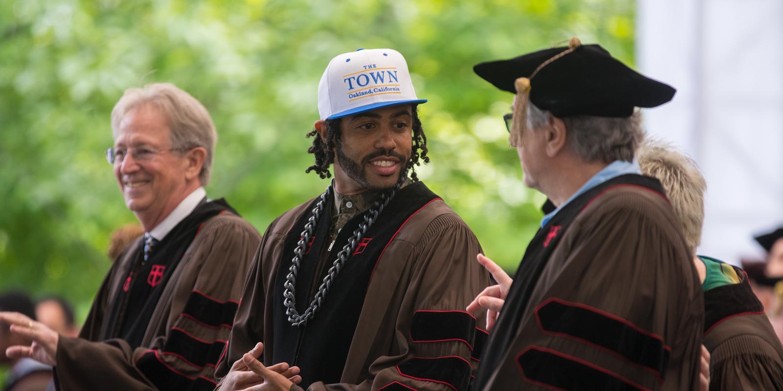Three of the University's six honorary degree recipients, Donald Hood, Daveed Diggs and Robert De Niro, shared a moment on the stage.