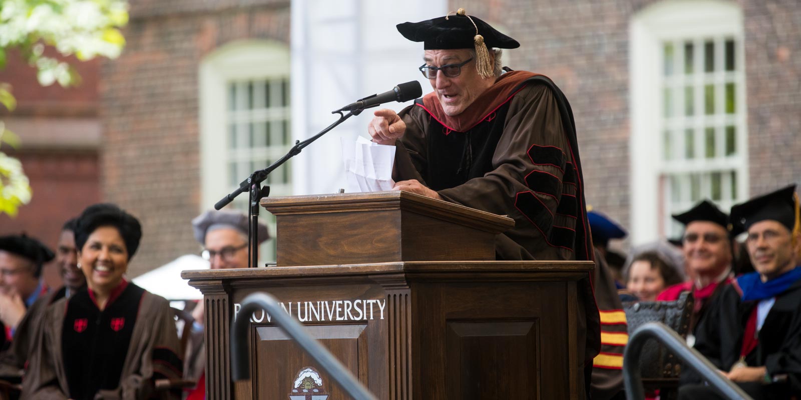 Likening the current political climate to a "tragic, dumbass comedy," honorary degree recipient Robert De Niro exhorted graduates to "work for the change."