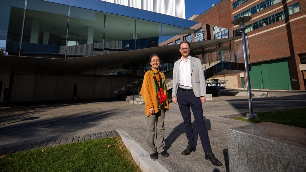 Eric Nathan and Sawako Nakayasu standing outside The Lindemann Performing Arts Center